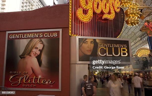 Billboards promoting a gentleman's club, part of the Fremont Street Experience located in downtown, is seen in this 2009 Las Vegas, Nevada, evening...