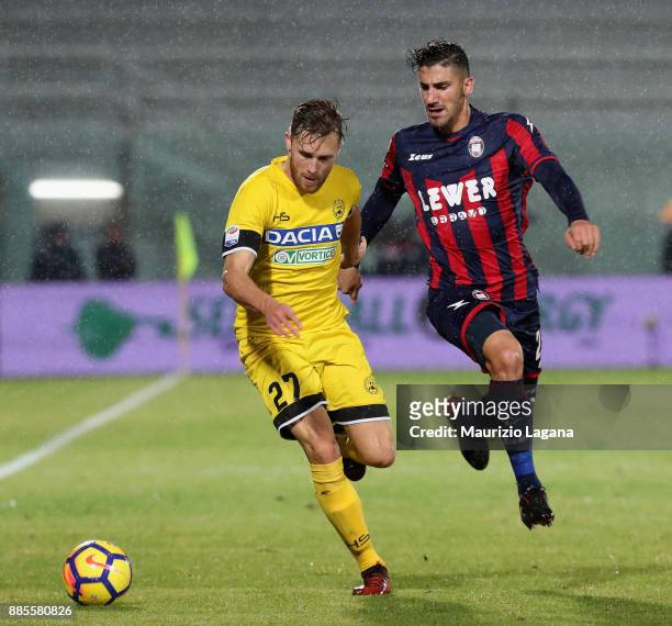 Marcello Trotta of Crotone competes for the ball with Silvan Widmer of Udinese during the Serie A match between FC Crotone and Udinese Calcio at...
