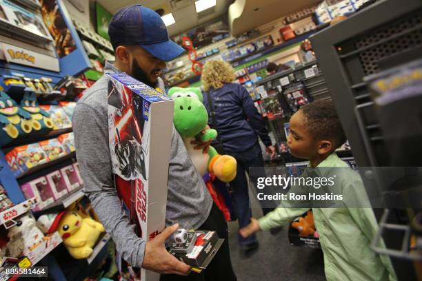 Cory Joseph of the Indiana Pacers particiaptes in the "Shop with the Pacers" christmas event at Circle Center Mall on December 3, 2017 in...