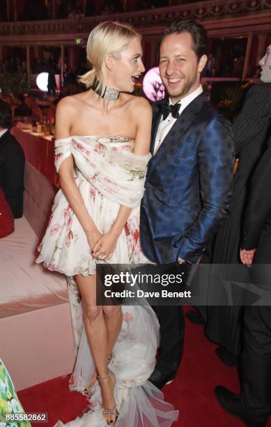 Poppy Delevingne and Derek Blasberg attend a drinks reception ahead of The Fashion Awards 2017 in partnership with Swarovski at Royal Albert Hall on...