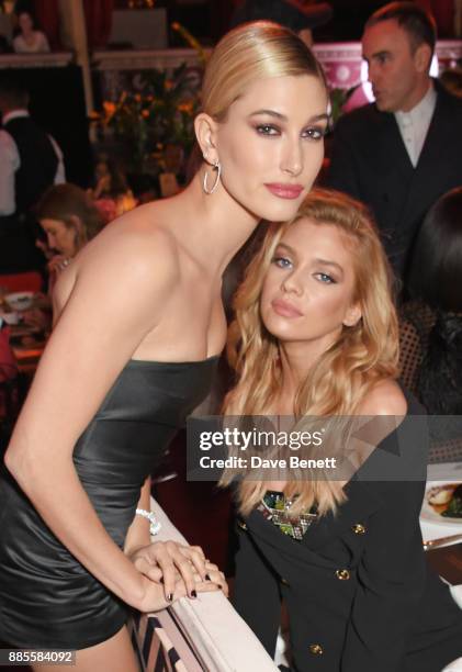 Hailey Baldwin and Stella Maxwell attend a drinks reception ahead of The Fashion Awards 2017 in partnership with Swarovski at Royal Albert Hall on...