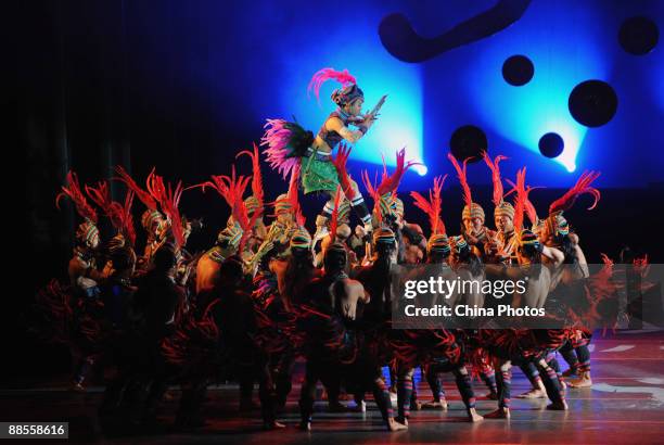 Artists perform during percussion dance "Sound of Yunnan" at the Qintai Grand Theatre on June 16, 2009 in Wuhan of Hubei Province, China. The dance...