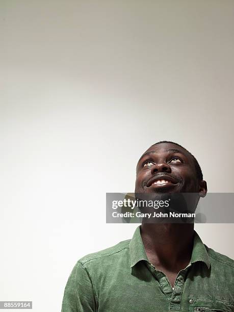 young man looking upwards - head back stock pictures, royalty-free photos & images