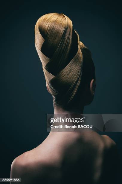 portrait of a young woman wearing a bun, back - woman lipstick rearview stock pictures, royalty-free photos & images