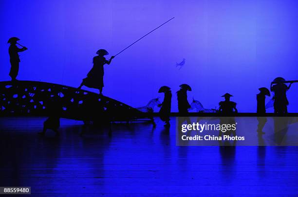 Artists perform during percussion dance "Sound of Yunnan" at the Qintai Grand Theatre on June 16, 2009 in Wuhan of Hubei Province, China. The dance...