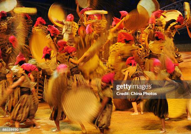 Artists perform during percussion dance "Sound of Yunnan" at the Qintai Grand Theatre on June 16, 2009 in Wuhan of Hubei Province, China. The dance...