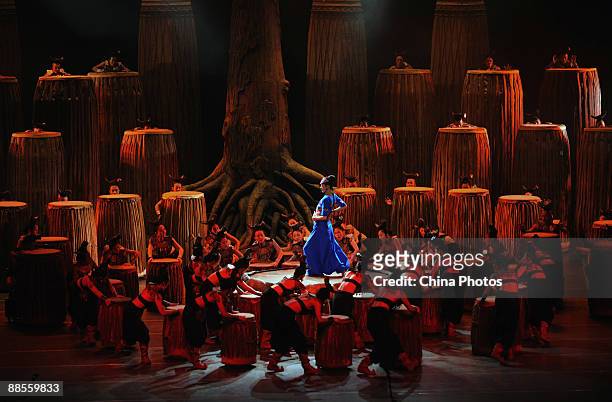 Chinese artist Yang Liping performs on stage in percussion dance "Sound of Yunnan" at the Qintai Grand Theatre on June 16, 2009 in Wuhan of Hubei...