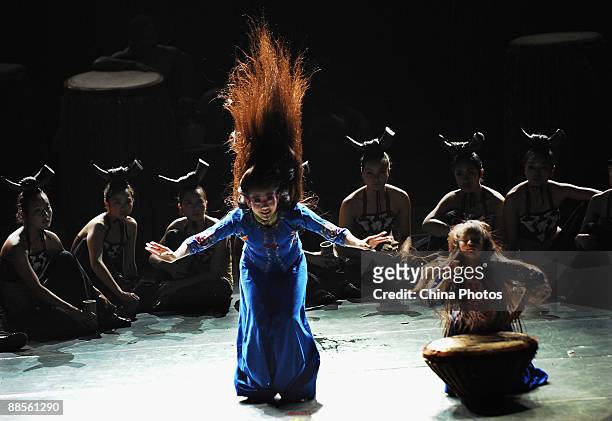 Chinese artist Yang Liping performs on stage in percussion dance "Sound of Yunnan" at the Qintai Grand Theatre on June 16, 2009 in Wuhan of Hubei...