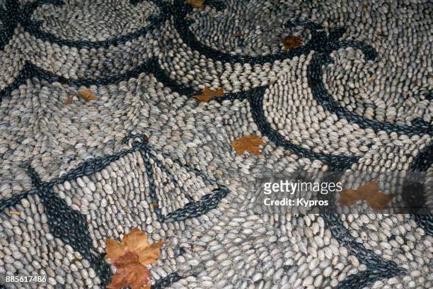 europe, greece, rhodes island, 2017: view of traditional pebble art using stones found on the beach to create pavement designs (or mosaic) - pebble island stock pictures, royalty-free photos & images