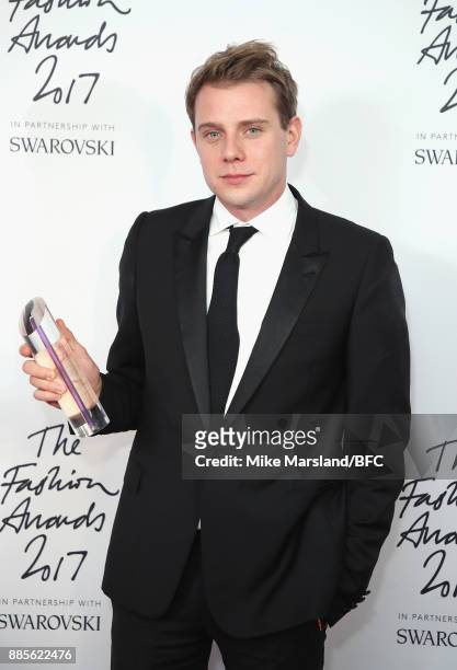 Anderson poses in the winners room with the Accessories Designer of the Year award during The Fashion Awards 2017 in partnership with Swarovski at...