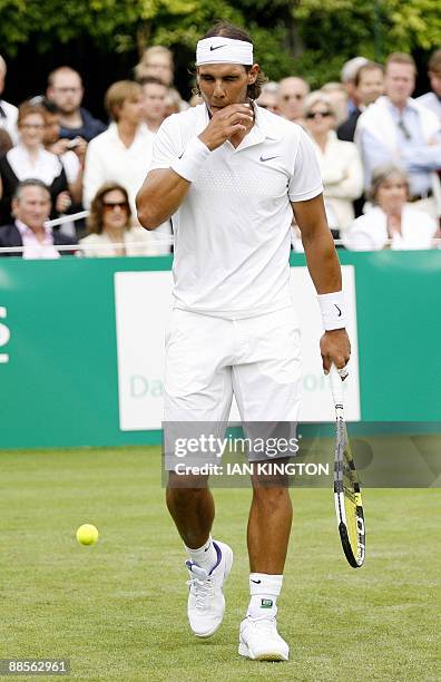 Rafael Nadal of Spain gestures during an exhibition match against Lleyton Hewitt of Australia at The Hurlingham Club in West London, England, on June...