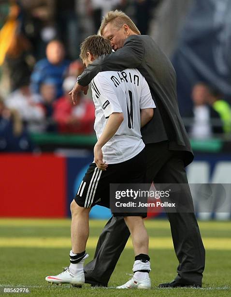 Head coach Horst Hrubesch hugs Marko Marin of Germany after the UEFA U21 Championship Group B match between Germany and Finland at the Oerjans vall...