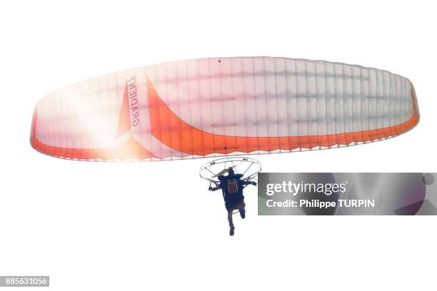 paramotor in white sky.. - motor paraglider stock pictures, royalty-free photos & images
