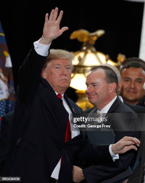 President Donald Trump waves to the crowd as he leaves after speaking at the Rotunda of the Utah State Capitol on December 4, 2017 in Salt Lake City,...