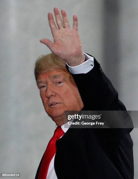 President Donald Trump waves to the crowd as he leaves after speaking at the Rotunda of the Utah State Capitol on December 4, 2017 in Salt Lake City,...