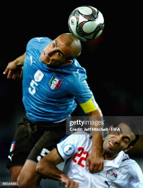 Mohamed Aboutrika of Egypt tackles Fabio Cannavaro of Italy during the FIFA Confederations Cup match between Egypt and Italy at Ellis Park Stadium on...