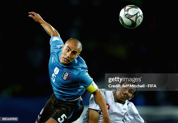 Mohamed Aboutrika of Egypt tackles Fabio Cannavaro of Italy during the FIFA Confederations Cup match between Egypt and Italy at Ellis Park Stadium on...