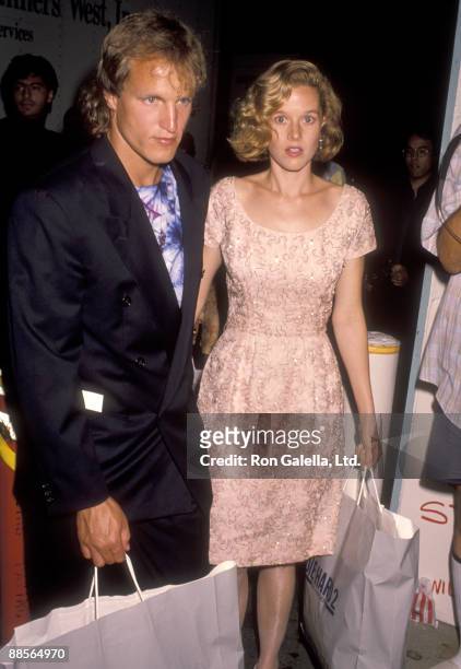 Actors Woody Harrelson and Penelope Ann Miller attend the "Die Hard 2" Westwood Premiere on July 2, 1990 at Avco Center Cinemas in Westwood,...