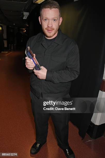 Craig Green, winner of the British Designer of the Year Menswear award, poses backstage at The Fashion Awards 2017 in partnership with Swarovski at...