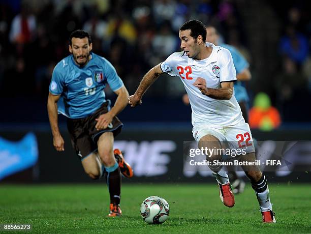 Mohamed Aboutrika of Egypt goes past Gianluca Zambrotta of Italy during the FIFA Confederations Cup Group A match between Egypt and Italy at the...