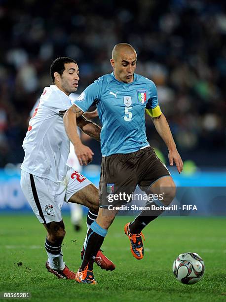Fabio Cannavaro of Italy goes past Mohamed Aboutrika of Egypt during the FIFA Confederations Cup Group A match between Egypt and Italy at the Ellis...