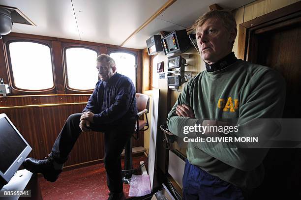 Thsi file picture shows whaler and Captain Olafur Olafsson and his number two Hafstian Omar Thorstainsson on April 21, 2009 in the central control...