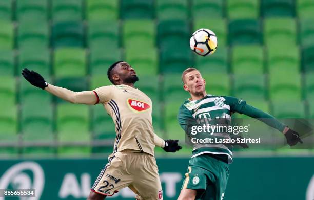 Roland Varga of Ferencvarosi TC battles for the ball in the air with Ianique dos Santos Tavares 'Stopira' #22 of Videoton FC during the Hungarian OTP...