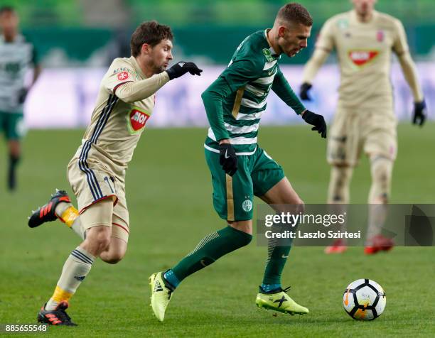 Roland Varga of Ferencvarosi TC leaves Mate Patkai of Videoton FC behind during the Hungarian OTP Bank Liga match between Ferencvarosi TC and...