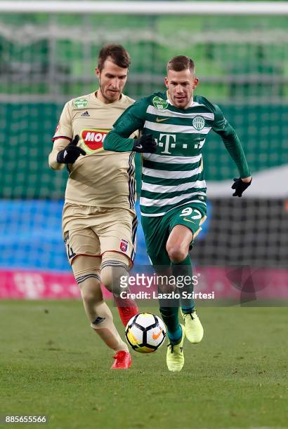 Roland Varga of Ferencvarosi TC competes for the ball with Marko Scepovic of Videoton FC during the Hungarian OTP Bank Liga match between...