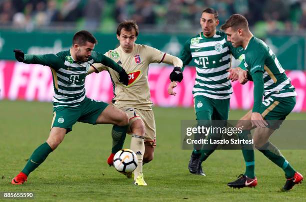 Endre Botka of Ferencvarosi TC fights for the ball with Danko Lazovic of Videoton FC next to Leandro De Almeida 'Leo' of Ferencvarosi TC and Miha...