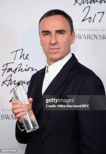 Raf Simons with the Designer of the Year Award in the winners room during The Fashion Awards 2017 in partnership with Swarovski at Royal Albert Hall...