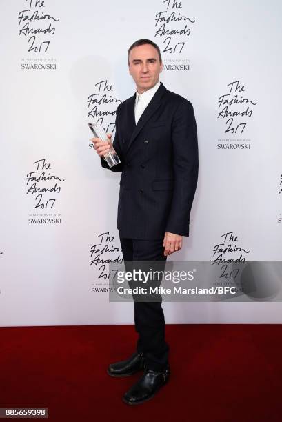 Raf Simons with the Designer of the Year Award in the winners room during The Fashion Awards 2017 in partnership with Swarovski at Royal Albert Hall...