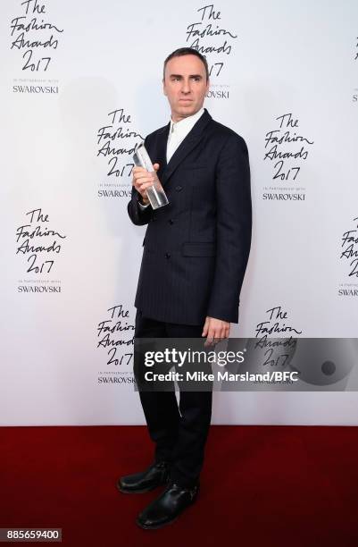 Raf Simons with the Designer of the Year Award in the winners room during The Fashion Awards 2017 in partnership with Swarovski at Royal Albert Hall...