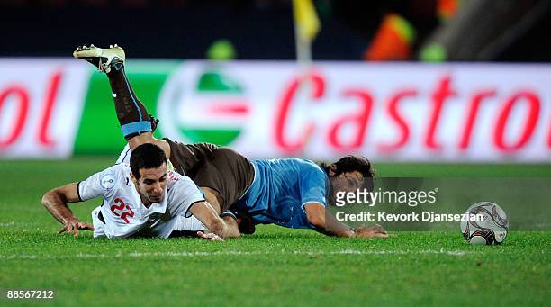 Gennaro Gattuso of Italy is tackled by Mohamed Aboutrika of Egypt during the FIFA Confederations Cup, between Italy and Egypt at Ellis Park Stadium...