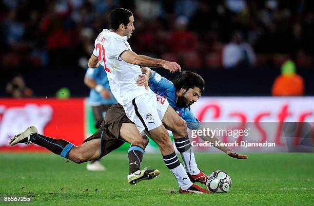 Gennaro Gattuso of Italy is tackled by Mohamed Aboutrika of Egypt during the FIFA Confederations Cup, between Italy and Egypt at Ellis Park Stadium...