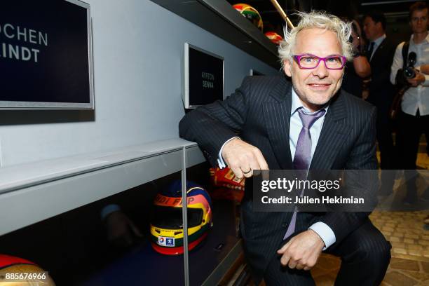 Formula 1 World Champion Jacques Villeneuve is pictured with his helmet during the FIA Hall of Fame Induction ceremony at Automobile Club De France...