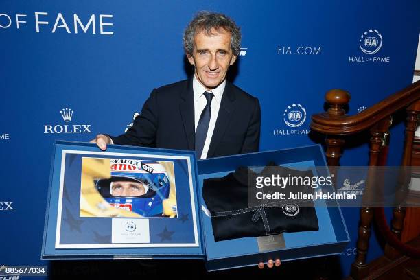 Quadruple World Champion Formula 1 Driver Alain Prost is pictured after being awarded during the FIA Hall of Fame Induction ceremony at Automobile...