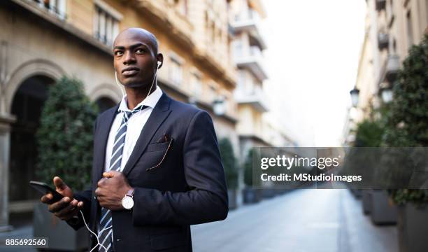 serious african businessman - nigeria city stock pictures, royalty-free photos & images