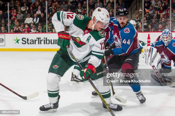 Mark Barberio of the Colorado Avalanche defends Eric Staal of the Minnesota Wild during the game at the Xcel Energy Center on November 24, 2017 in...