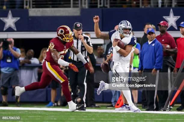 Dallas Cowboys quarterback Dak Prescott is shoved out of bounds by Washington Redskins linebacker Zach Brown during the Thursday Night Football game...