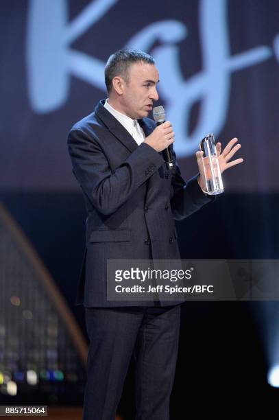 Raf Simons accepts his award during The Fashion Awards 2017 in partnership with Swarovski at Royal Albert Hall on December 4, 2017 in London, England.