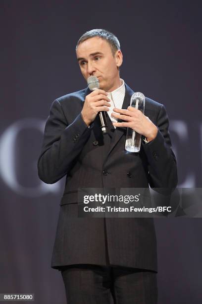 Raf Simons accepts his award during The Fashion Awards 2017 in partnership with Swarovski at Royal Albert Hall on December 4, 2017 in London, England.