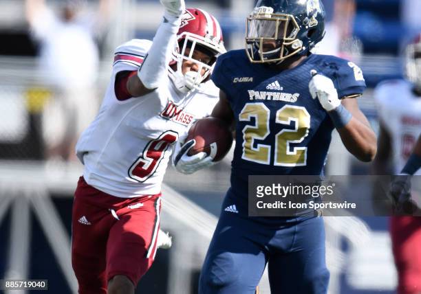 UMass defensive back Isaiah Rodgers prepares to knock the ball away from Florida International University running back Shawndarrius Phillips during...