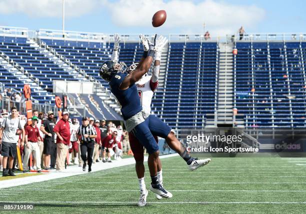 Florida International University wide receiver Bryce Singleton (RL_171202 catches a touchdown pass against UMass defensive back Isaiah Rodgers during...