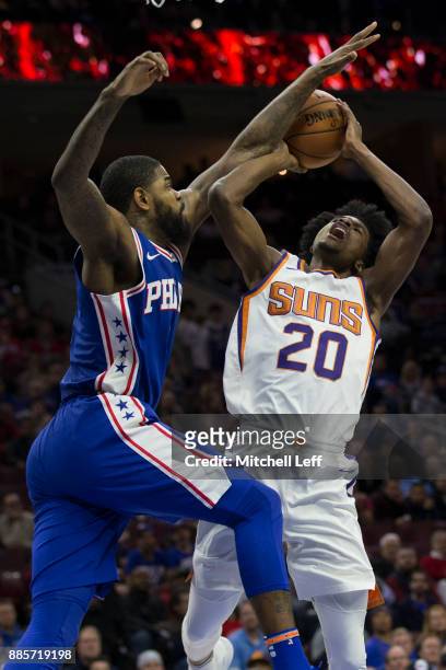 Josh Jackson of the Phoenix Suns attempts a shot against Amir Johnson of the Philadelphia 76ers in the first quarter at the Wells Fargo Center on...