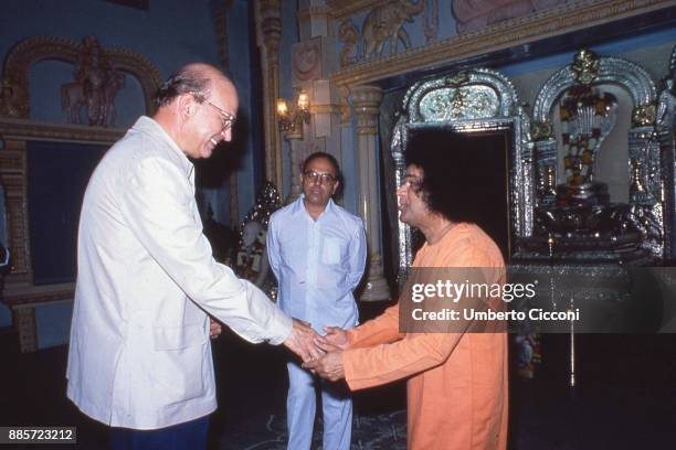Politician Bettino Craxi is with his brother Antonio Craxi and Indian guru Sathya Sai Baba, India 1986.