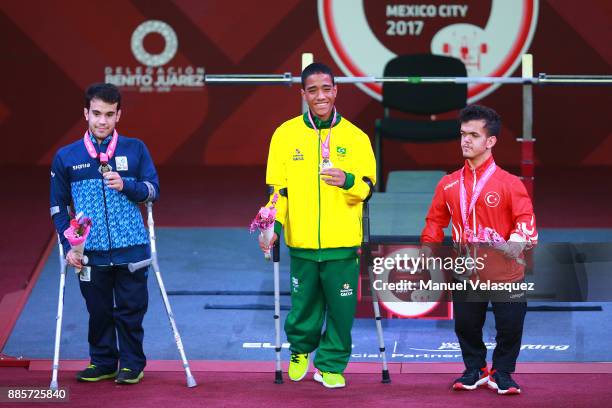 Second Place, Rodrigo Villamarin , First Place, Lucas dos Santos and Third Place, Soner Coskun pose in the podium after the Men's Up to 49 Kg Group A...