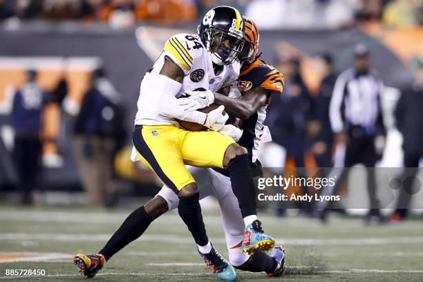 Antonio Brown of the Pittsburgh Steelers is tackled by Dre Kirkpatrick of the Cincinnati Bengals after a reception during the first half at Paul...