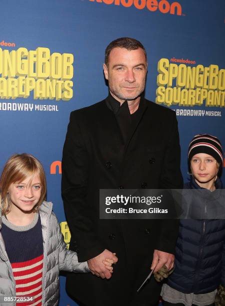 Liev Schreiber and sons pose at the opening night arrivals for the new musical "Spongebob Squarepants" on Broadway at The Palace Theatre on December...