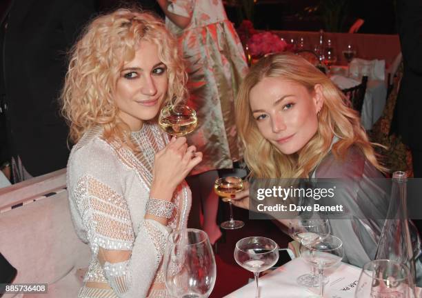Pixie Lott and Clara Paget attend The Fashion Awards 2017 in partnership with Swarovski after party at Royal Albert Hall on December 4, 2017 in...